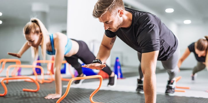 Man and Woman Training in the Gym