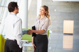two colleagues shaking hands