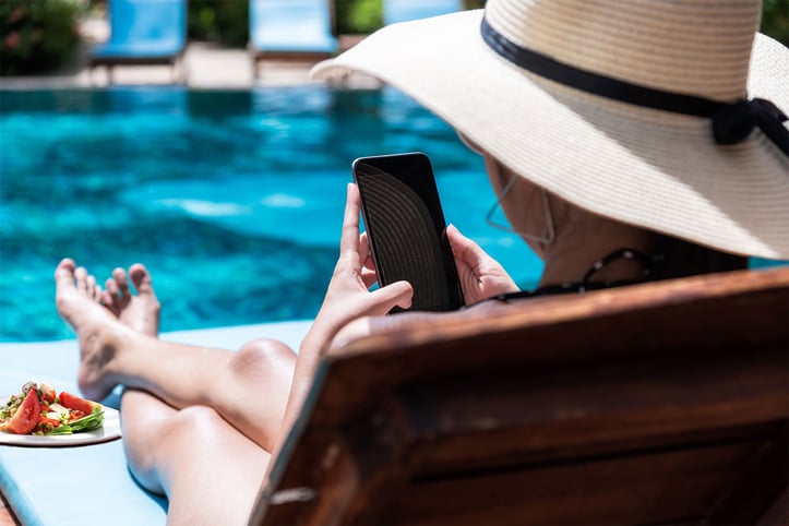 a woman on vacation looking at her phone