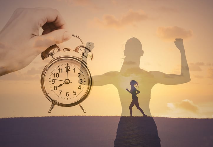 An image of a lady running with a clock graphic design