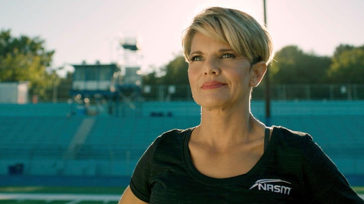 Female NASM trainer posing for photo