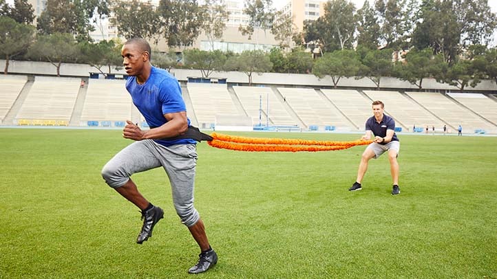 NASM training assisting athletes with resistant bands