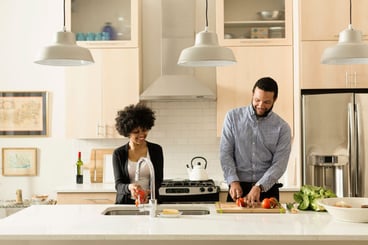 Woman and man cooking in kitchen