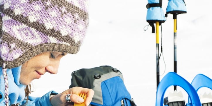 A women eating soup in the winter