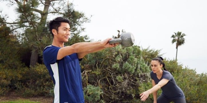 A man doing a kettlebell workout