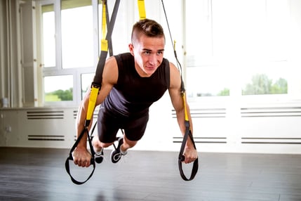 Man doing TRX exercise