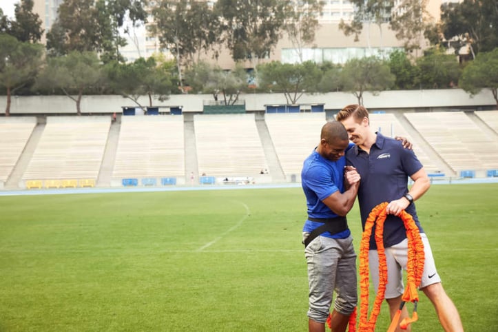 Client hugging NASM Trainer