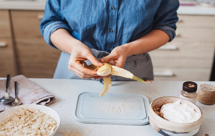 woman peeling a banana