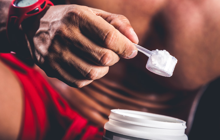 A man using workout supplements