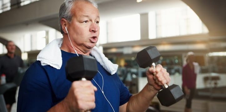 senior doing dumbbell workout