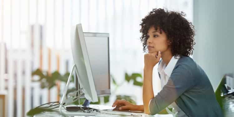 lady at desk leaning forward