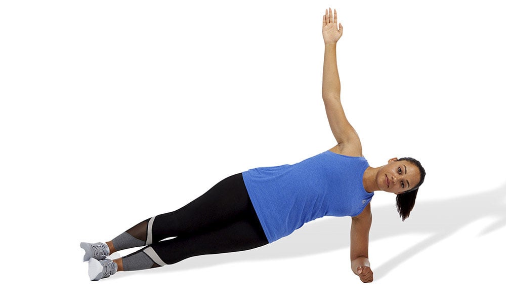 woman doing a hip-extension plank