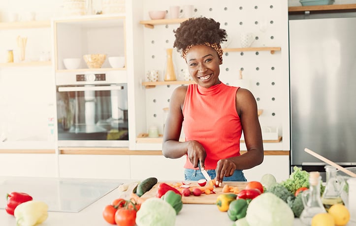 a woman preparing food and counting her macros