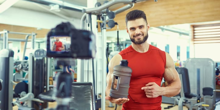 A Man Taking a Photo in the Gym
