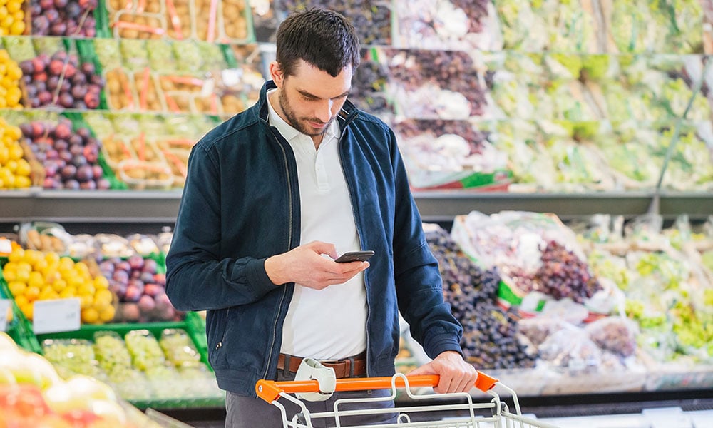 man shopping in grocery store