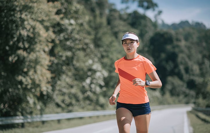a woman with mental toughness running outside