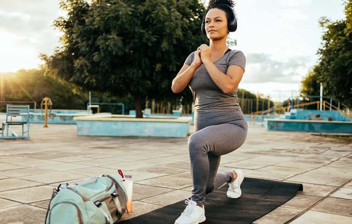 A Women doing lunges In a Park