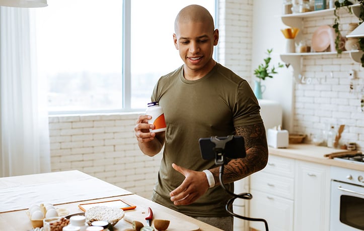 a nutritionist showing followers what supplements they can use over a live stream