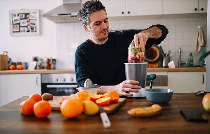 a man making a healthy smoothie