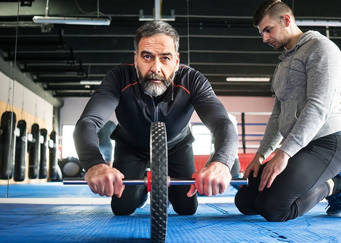 older-man-doing-ab-roller