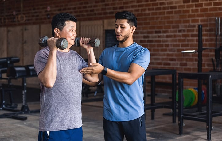 a personal trainer using the talk test with a client