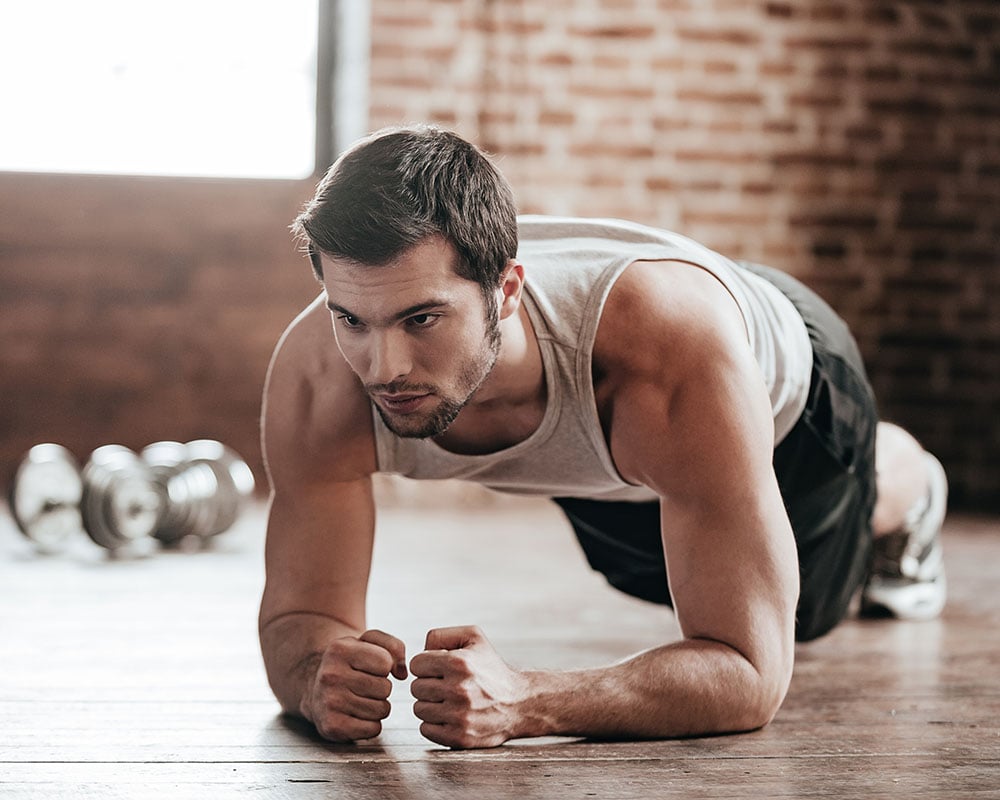 a man doing an isometric plank