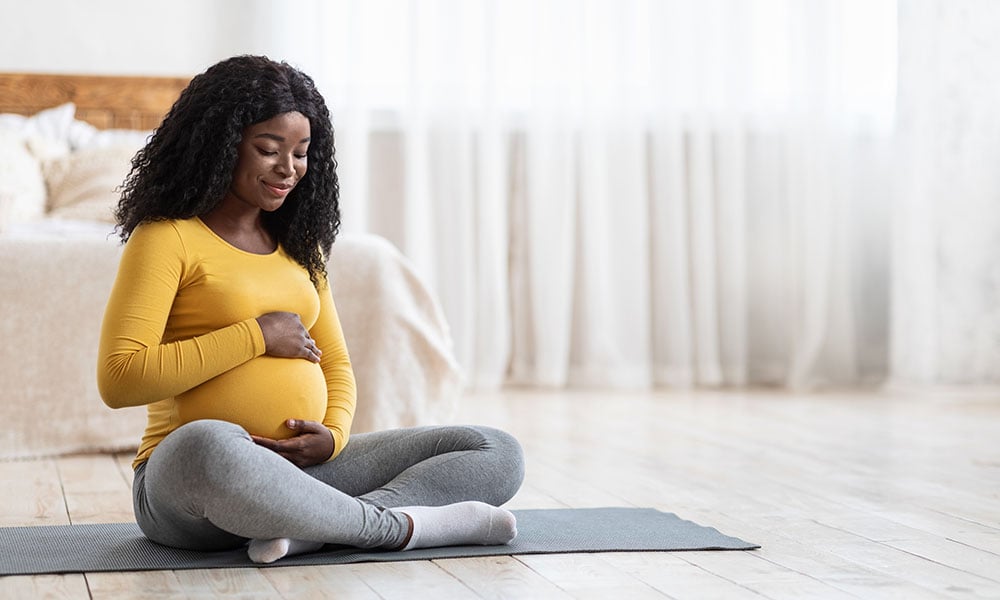 a woman doing prenatal yoga