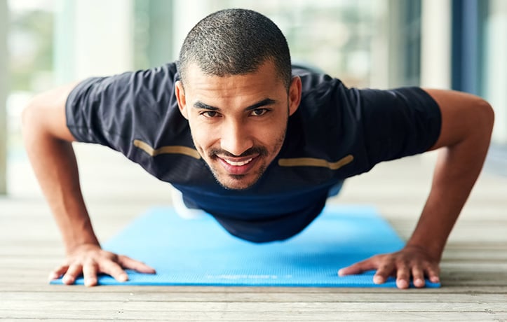 a man doing pushup progressions