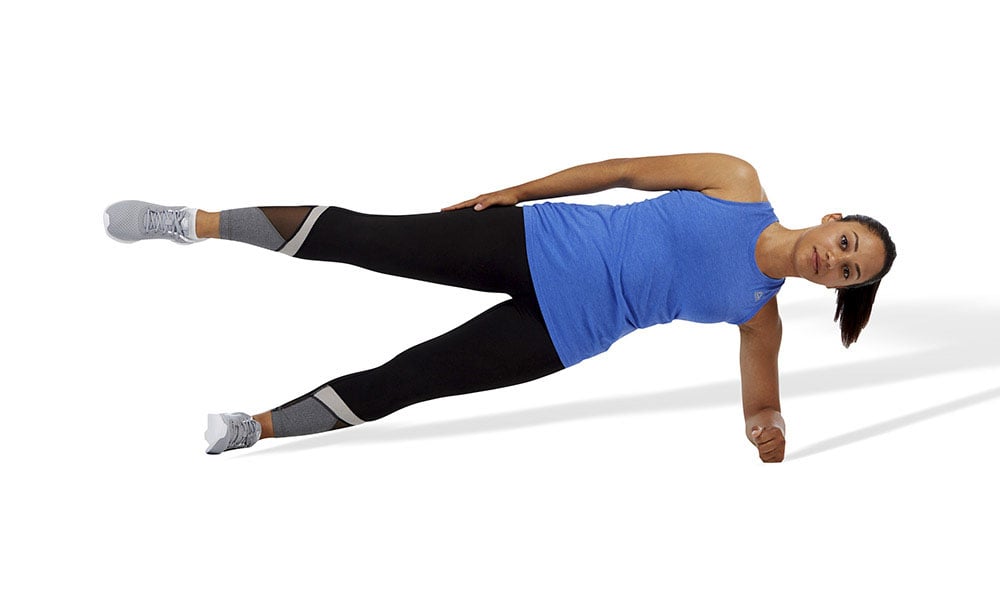 woman doing a side plank with hip abduction