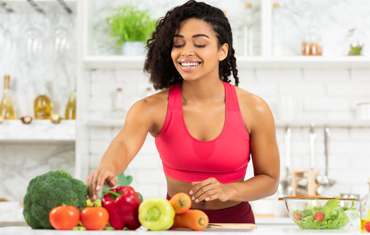 A woman prepping food in the kitchen