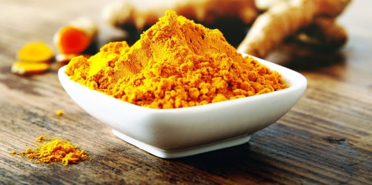 bowl of turmeric powder