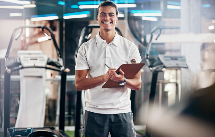 trainer smiling in the gym 