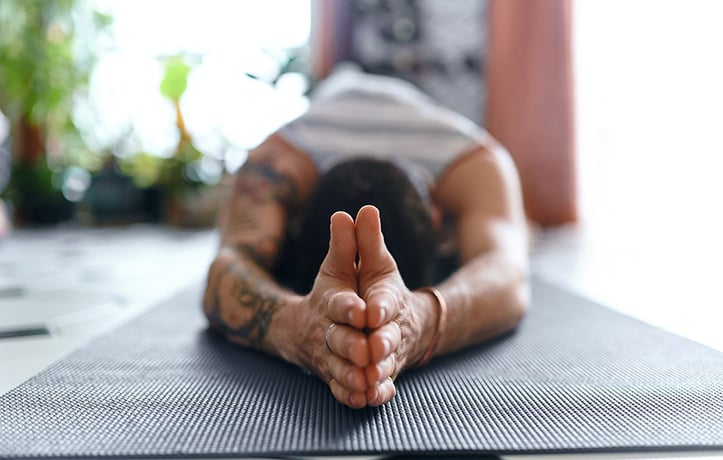 man doing child pose