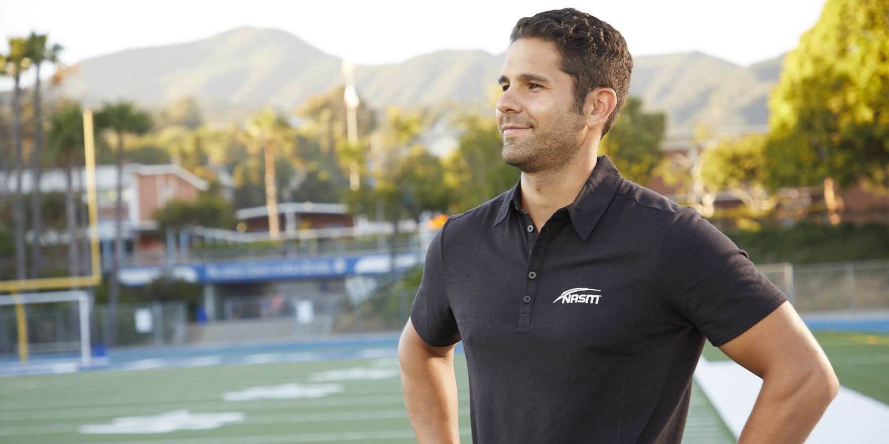 Personal trainer standing on outdoors