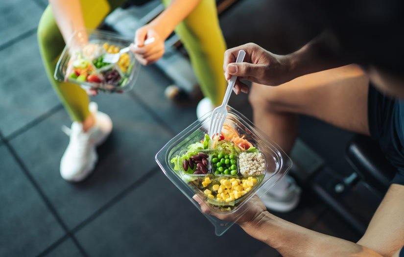 Trainers eating in the gym