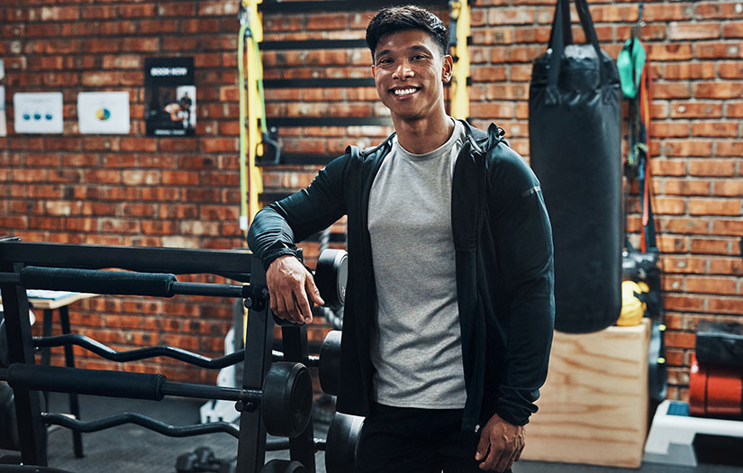 a gym owner smiling in his fitness business