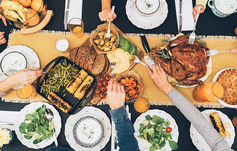 a healthy thanksgiving dinner being shared with friends and family