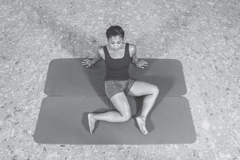 figure 2 of woman doing a hip spine shoulder stretch - flexibility training