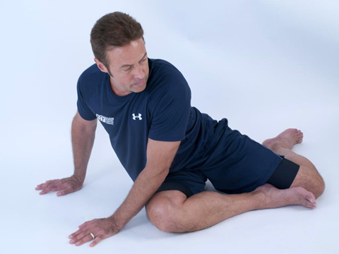 forward position of dynamic back rotation stretch - flexibility training