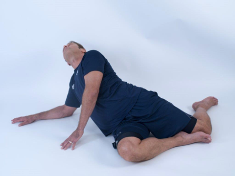 man doing a hip flexor stretch