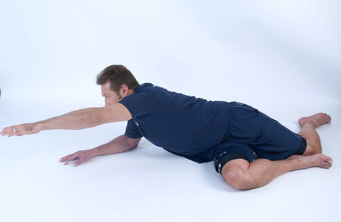 man doing a side dynamic stretch