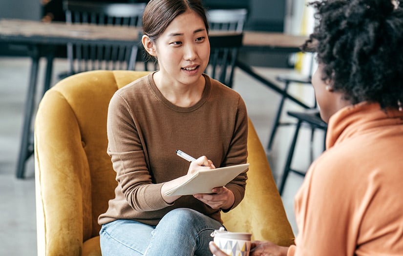 a woman practicing motivational interviewing with a client