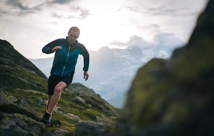 ultra endurance athlete running on a mountain